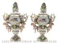 A Pair of German Porcelain Urns and Covers