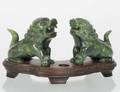 PAIR OF CARVED SPINACH JADE FIGURES OF FU DOGS
