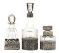 A Group of Three Continental Etched Glass and Silver Overlay Bottles