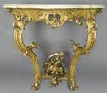 A Louis XV Giltwood Corner Table