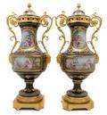 A Pair of Sevres Style Gilt Metal Mounted Covered Urns