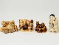 FOUR CARVED IVORY NETSUKES