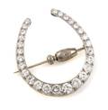 A Platinum and Diamond Horseshoe Brooch