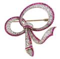 A Platinum 18 Karat Yellow Gold Ruby and Diamond Bow Pin