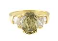 An 18 Karat Yellow Gold and Fancy Color Diamond Ring