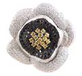 An 18 Karat White Gold Black and White Diamond and Yellow Sapphire Flower PendantBrooch