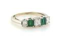 A Platinum Diamond and Emerald Ring