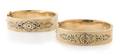 A Pair of 14 Karat Yellow Gold and Black Enamel Engraved Hinged Bangle Bracelets Circa 1890