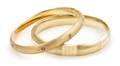 A Set of Two 14 Karat Yellow Gold Bangle Bracelets