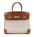 An Hermes Tan Leather and Canvas Birkin