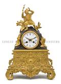 A Continental Gilt and Patinated Metal Mantel Clock