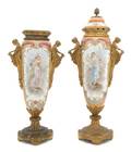 A Near Pair of Sevres Style Gilt Metal Mounted Covered Urns