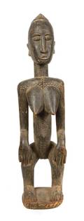 An African Carved Wood Female Figure