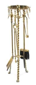 A Continental Brass Fireplace Tool Set
