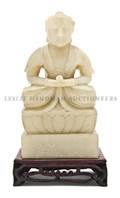 A Carved Soapstone Figure of a Seated Buddha