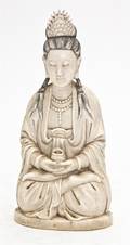 A Chinese Carved Ivory Seated Figure