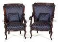A Pair of Victorian Carved Mahogany Open Armchairs