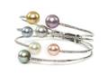 A 18 Karat White Gold Diamond and Multi Color Pearl Cuff Bracelet
