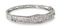 A 10 Karat White Gold and Diamond Bangle Bracelet