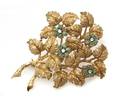 An 18 Karat Yellow Gold Emerald and Diamond Foliate Brooch
