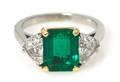 A Platinum 18 Karat Yellow Gold Emerald and Diamond Ring