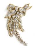 An 18 Karat Two Tone Gold and Diamond Brooch