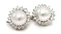 A Pair of Platinum Cultured South Sea Pearl and Diamond Earclips