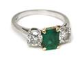 A Platinum 18 Karat Yellow Gold Emerald and Diamond Ring