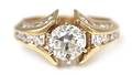 A 14 Karat Yellow Gold and Diamond Ring