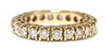 A 14 Karat Yellow Gold and Diamond Eternity Band