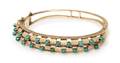 A 14 Karat Yellow Gold and Turquoise Bead Bangle Bracelet