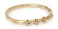 A 14 Karat Yellow Gold and Diamond Hollow Bangle Bracelet