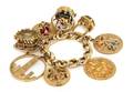 A 14 Karat Yellow Gold Charm Bracelet with Eight Attached Yellow Gold Charms