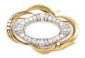 A Platinum 14 Karat Yellow Gold and Diamond Brooch