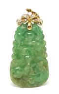 An 18 Karat Yellow Gold Diamond and Carved Jade Pendant