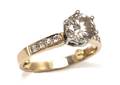 A 14 Karat Yellow Gold and Diamond Ring