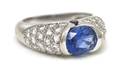 An 18 Karat White Gold Sapphire and Diamond Ring