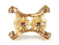 An 18 Karat Two Tone Gold and Ruby Pin