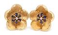 A Pair of 14 Karat Yellow Gold Sapphire and Diamond Textured Flower Earclips