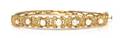 A 14 Karat Yellow Gold and Pearl Bangle Bracelet