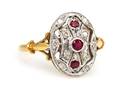 An 18 Karat Two Tone Gold Ruby and Diamond Ring