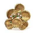 An 18 Karat Yellow Gold Emerald and Diamond Textured Brooch