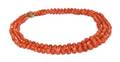 A 14 Karat Yellow Gold and Triple Strand Graduated Coral Bead Necklace