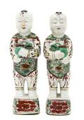 A Pair of Chinese Porcelain Figures of Standing Boys