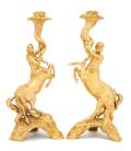 A Pair of Continental Gilt Bronze Figural Candlesticks