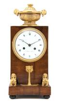 A French Egyptian Revival Mahogany and Gilt Bronze Mounted Mantel Clock Ballion