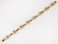 EIGHTEEN KARAT YELLOW GOLD AND BLUE TOPAZ BRACELET