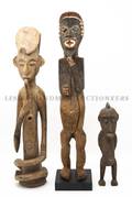 A Collection of Five Carved Wood African Figures