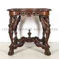 A Carved Mahogany Figural Occasional Table