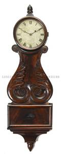 A Carved Mahogany Wall Clock